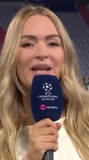 Laura Woods speaking into a TNT Sports Champions League microphone.
