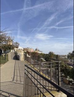 Overlook in Palma, Majorca, with a metal railing and a view of the sea and city.