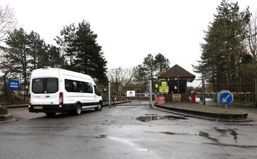 Minibus at the entrance to Wethersfield Village asylum center.