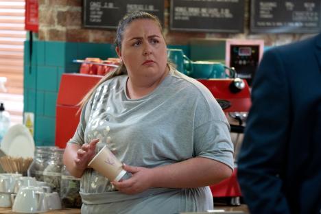 Bernadette Taylor from EastEnders holding a coffee cup.