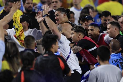 Uruguay players celebrate during a soccer match.