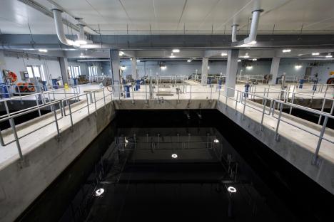 Holy Trinity church in Marham, Norfolk, with a red car parked nearby.