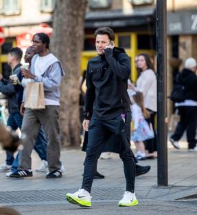 Mark Wright on a phone call while walking in London.
