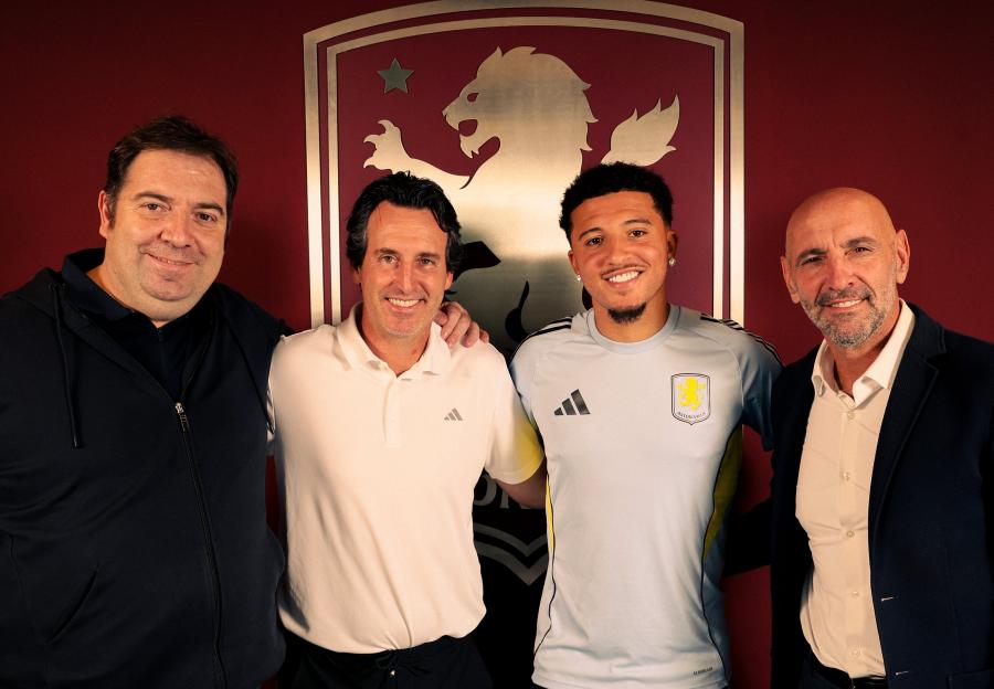 Jadon Sancho with Aston Villa officials.