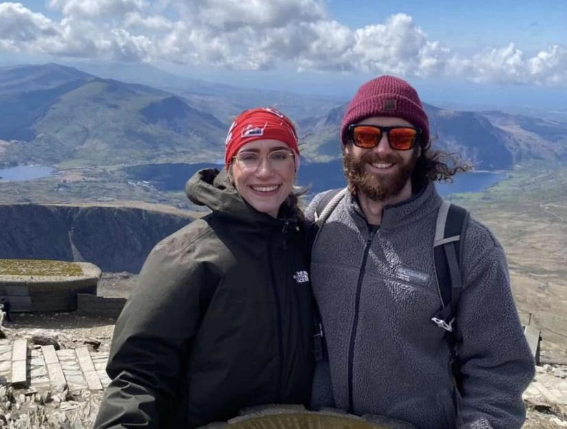 Photo of Sarah Jane Thompson and Alexander Barrett on a mountaintop.