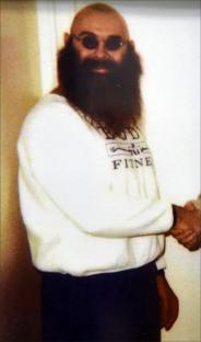 Charles Bronson, British criminal, in a white sweatshirt.