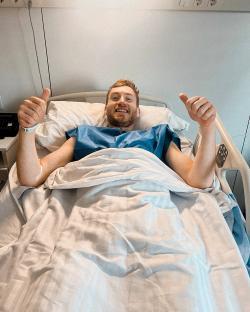 Dejan Kulusevski giving a thumbs-up from a hospital bed.