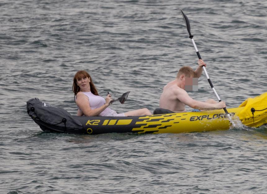 Angela Rayner and a man in a yellow inflatable kayak on the water.