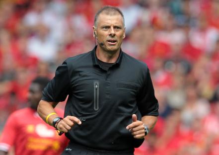 Referee at a Liverpool F.C. soccer match.