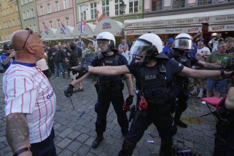 Riot police confronting Chelsea fans.