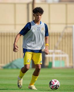 Cristiano Ronaldo Jr. playing soccer.