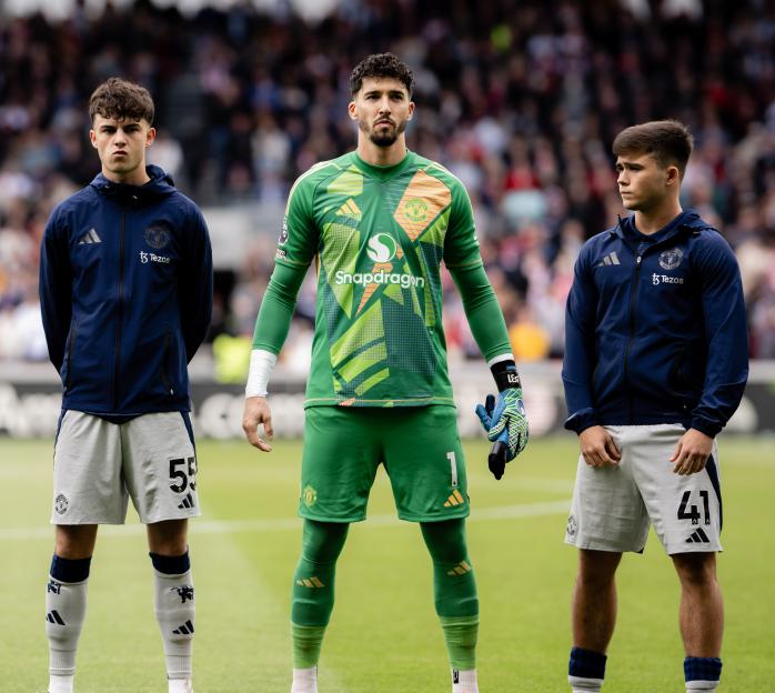 Manchester United players lining up before a match.