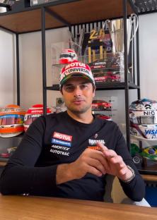 Nelson Piquet Jr. wearing a racing shirt.