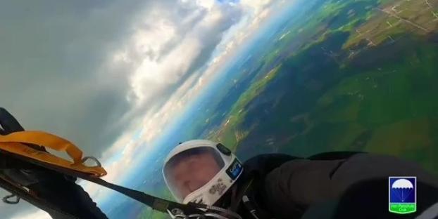 First-person skydiving video showing a tangled parachute.