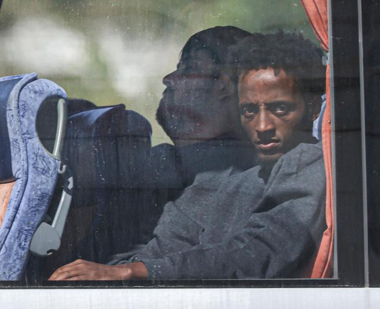 Migrants on a bus.