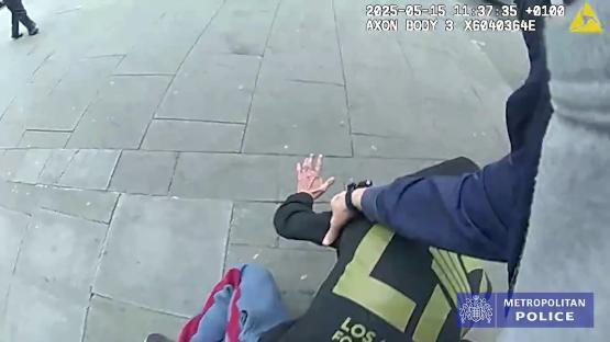 Police officer arresting a shoplifter.