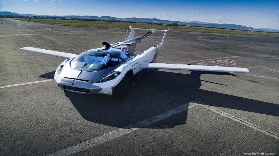 AirCar V5 flying car on an airfield.