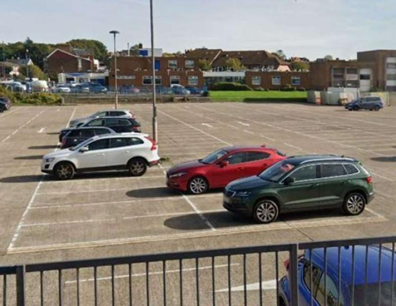 Cars parked in a lot.