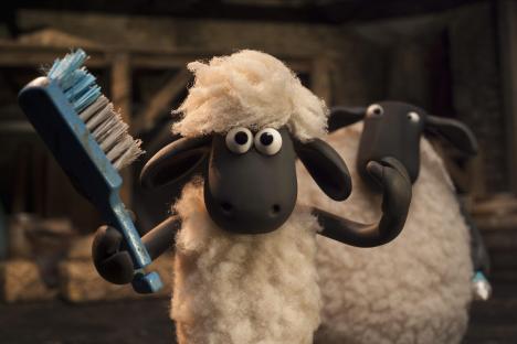 Shaun the Sheep holding a brush.