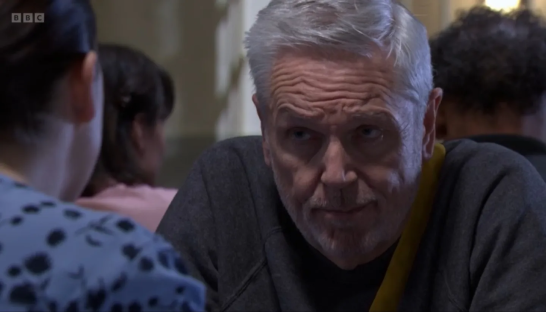 Close-up of a man looking thoughtfully.