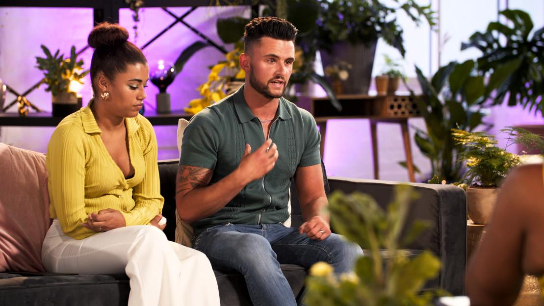 Chanita and Jordan seated and speaking.