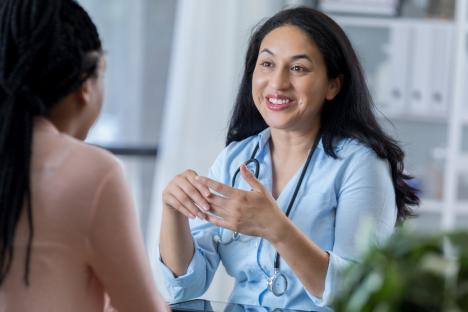 Female doctor talking to a patient.