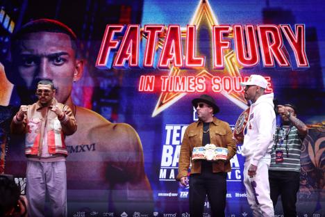 NEW YORK, NEW YORK - APRIL 28: Teofimo Lopez poses for the audience as Arnold Barboza Jr. looks on during grand arrivals before his Ring and Super Lightweight title fight at The Manhattan Center on April 28, 2025 in New York City. (Photo by Cris Esqueda/Golden Boy/Getty Images)