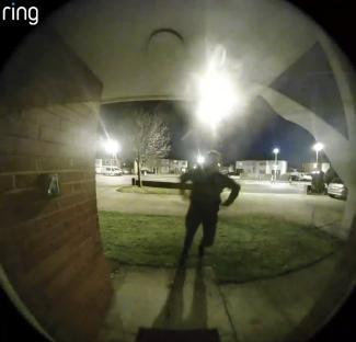 Ring doorbell camera footage of a suspect fleeing a crime scene.
