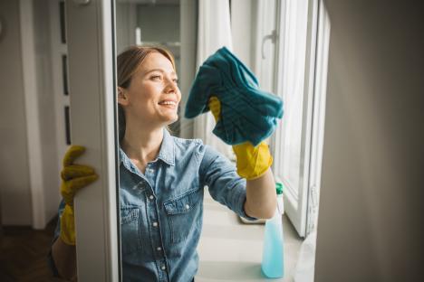 Woman cleaning a window.