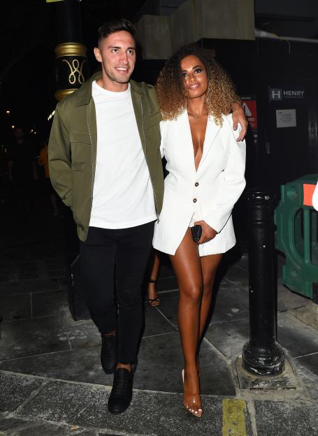 Greg O'Shea with his arm around Amber Gill.