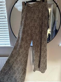 Leopard print wide-leg trousers.