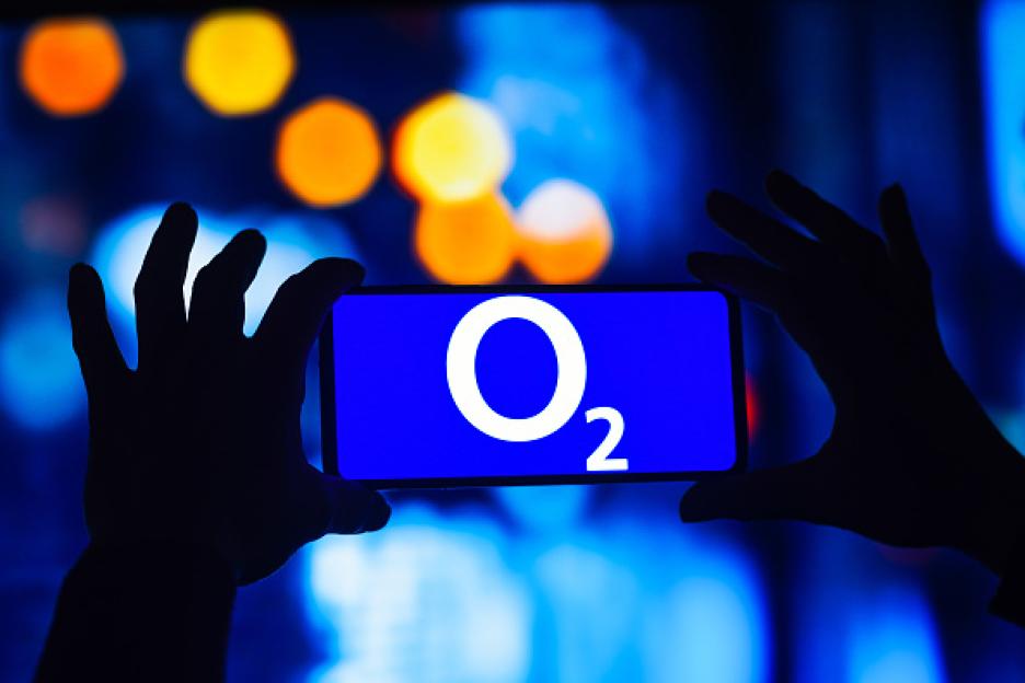 Illustration of the O2 UK logo displayed on a smartphone.