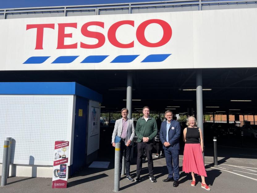 Liam Conlon, Labour MP for Beckenham and Penge, second from left, Clock House Ward Councillor Jeremy Adams, far left, and community campaigner Jenny Coleman, with Stuart, Store Manager at Elmers End Tesco Superstore. / Locals in a south London suburb are calling for an end to "dangerous" car drifting in a supermarket car park - which they say has kept them and their children awake for years. Residents in Elmers End say petrolheads using a Tesco superstore's car park keeps them up at night and lowers their quality of life. Videos of a recent car meet show crowds of people having to dodge out of the way as screeching cars drift around the car park. Liam Conlon, the Labour MP for the area, says so many of his constituents have written to him about the issue that he started a petition calling for action. Photo released 23/09/2025