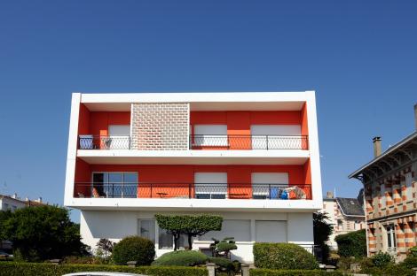 Modern orange and white house in Royan, France.