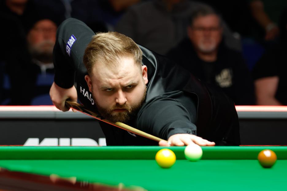 Jackson Page of Wales playing snooker.