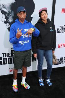 Pharrell Williams and his wife Helen Lasichanh at a premiere.