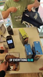 Person showing Boots merchandise and a payment terminal.