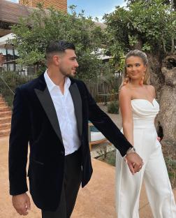 Molly Mae Hague, Tommy Fury, and their baby daughter in a restaurant.