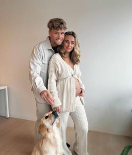 Tiffany Watson and her partner, pregnant, with their dog.