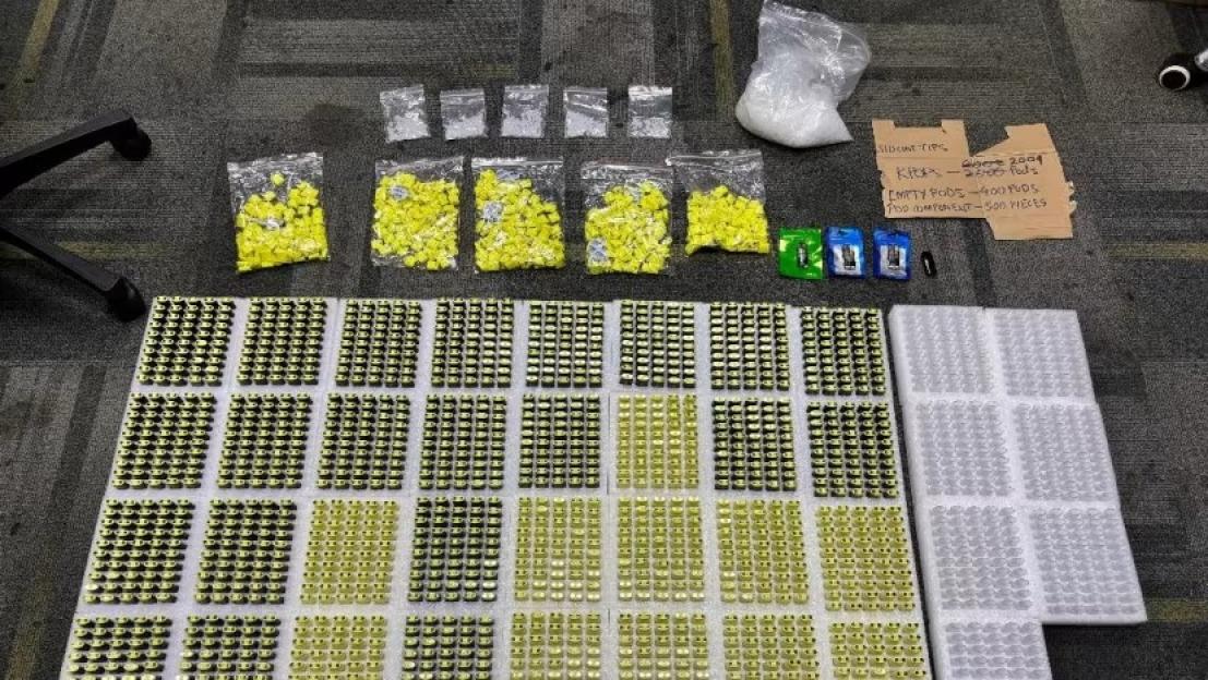 Seized Kpod vaping materials including pods, components, and drugs.