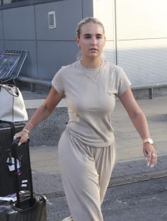 Molly Mae and Tommy Fury arriving at an airport.