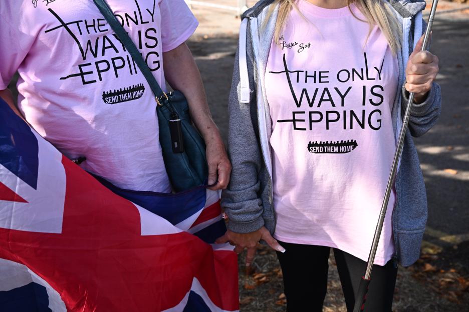 Protesters wearing "Send them home" shirts.