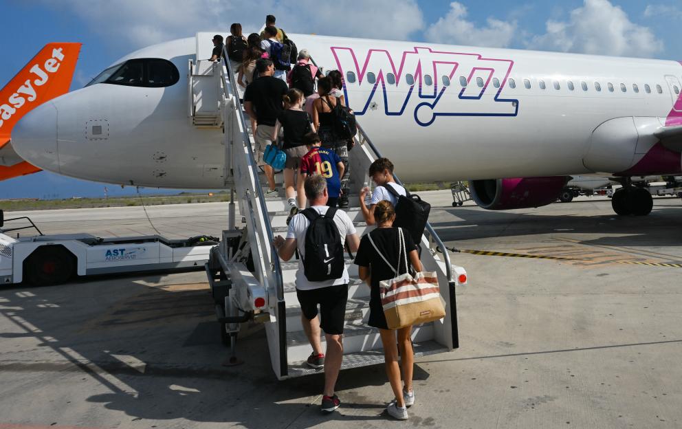 Passengers boarding a Wizz Air plane.