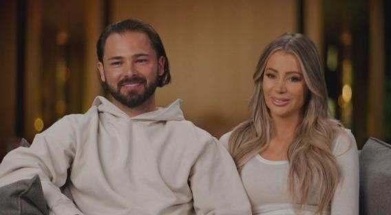 Bradley Dack and Olivia Attwood smiling for the cameras on *Olivia Marries Her Match*.