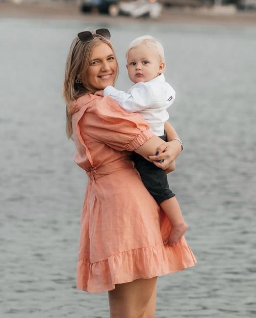 Anastasiia Chikina holding her son Oliver Pugh in Marbella, Spain.