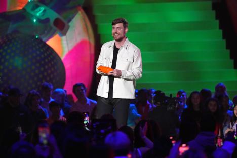 MrBeast speaking onstage at the Nickelodeon Kids' Choice Awards.