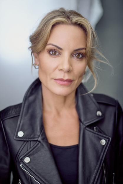 Headshot of Charlotte wearing a black leather jacket.