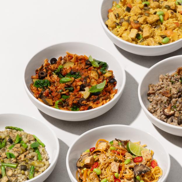 Collage of five bowls of various prepared meals.
