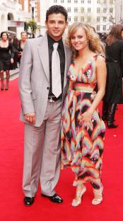 Ryan Thomas and Tina O'Brien at an awards ceremony.
