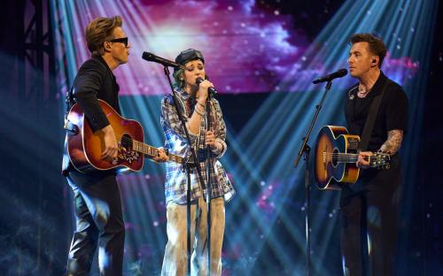 Tom Fletcher, Ava, and Danny Jones performing on The Voice UK.